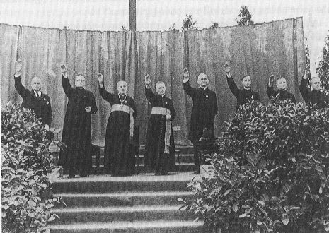 Clergy attending a religious Youth Rally for Jesus saluting Adolf Hitler